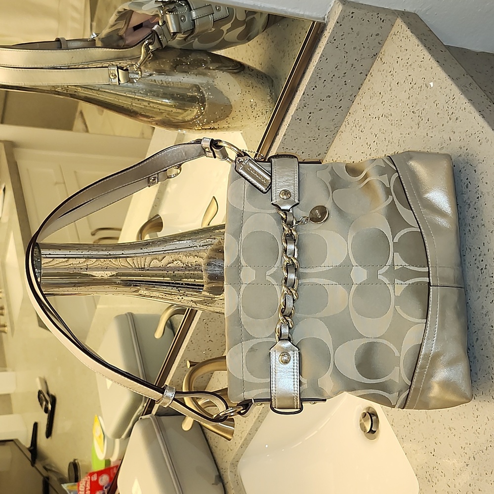 Coach silver leather and fabric handbag with an adjustable strap very good condi